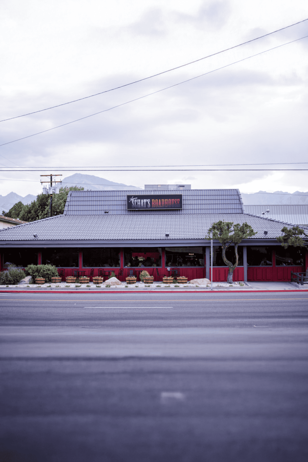 Comfortable restaurant exterior with mountain views, perfect for dining and local exploration.