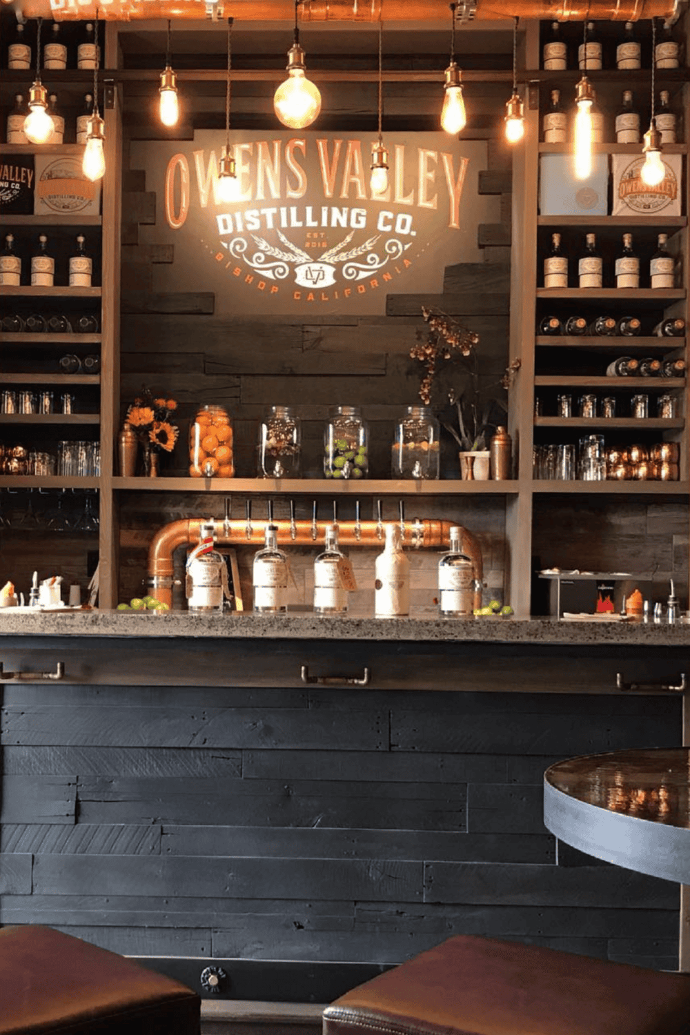 Sophisticated distillery bar at Owens Valley Distilling Co. in California with craft spirits and stylish decor.