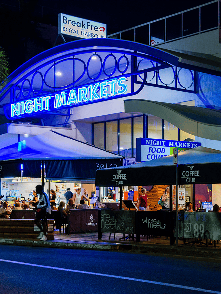 Night markets with vibrant food stalls and bustling crowds at Royal Harbour.