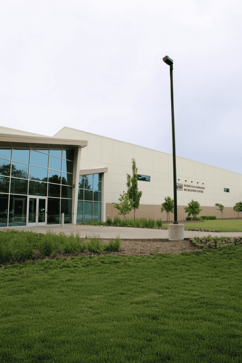 Accessible community recreation center with modern architecture and landscaped outdoor space.