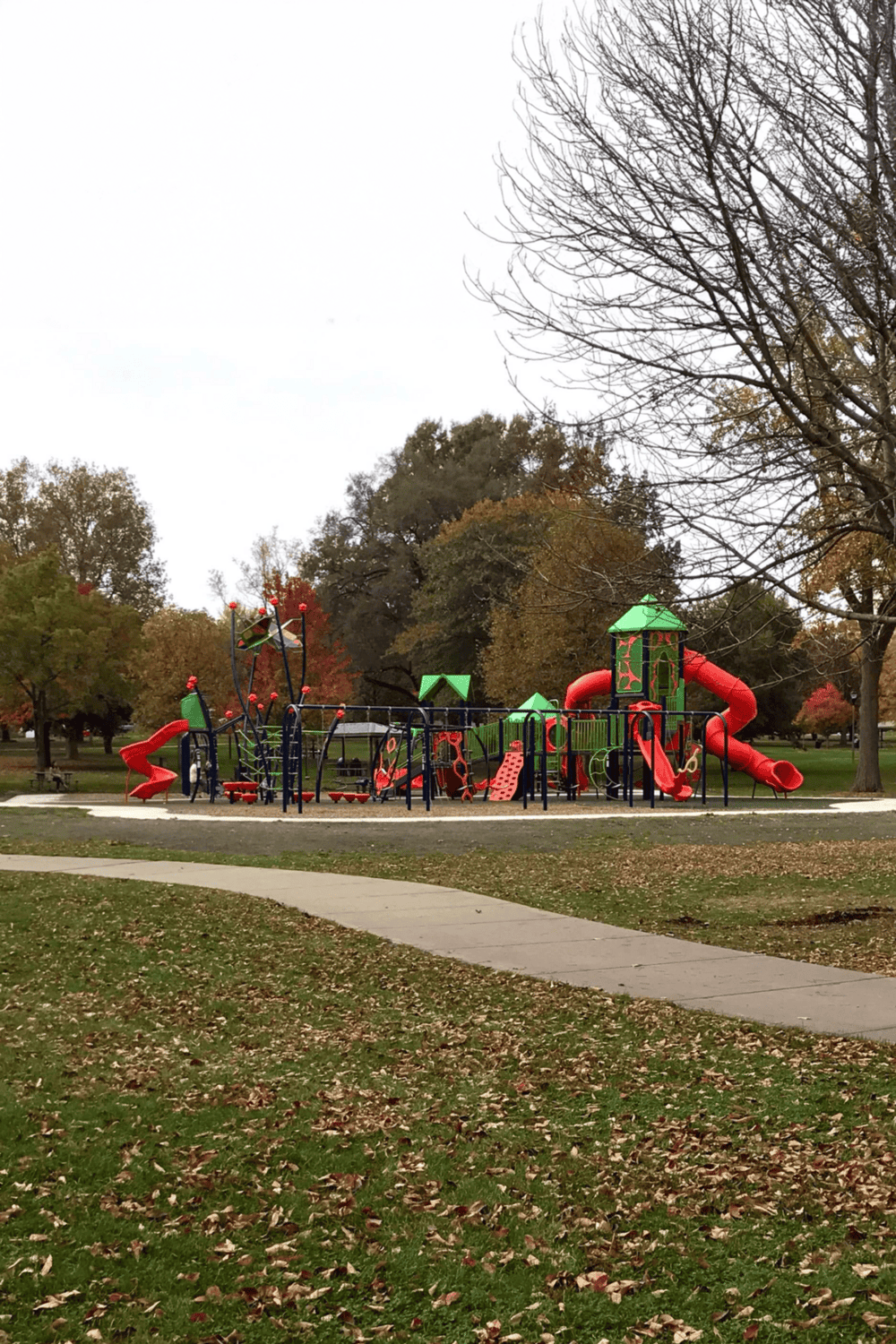 Colorful outdoor playground equipment in a park for children’s recreation and family outings.