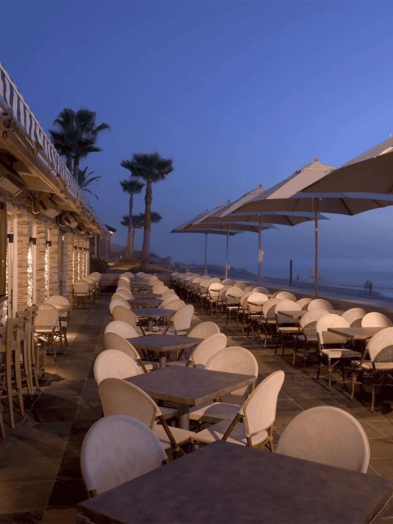 Enjoying seaside dining at Sunset Beach Cafe during evening hours.