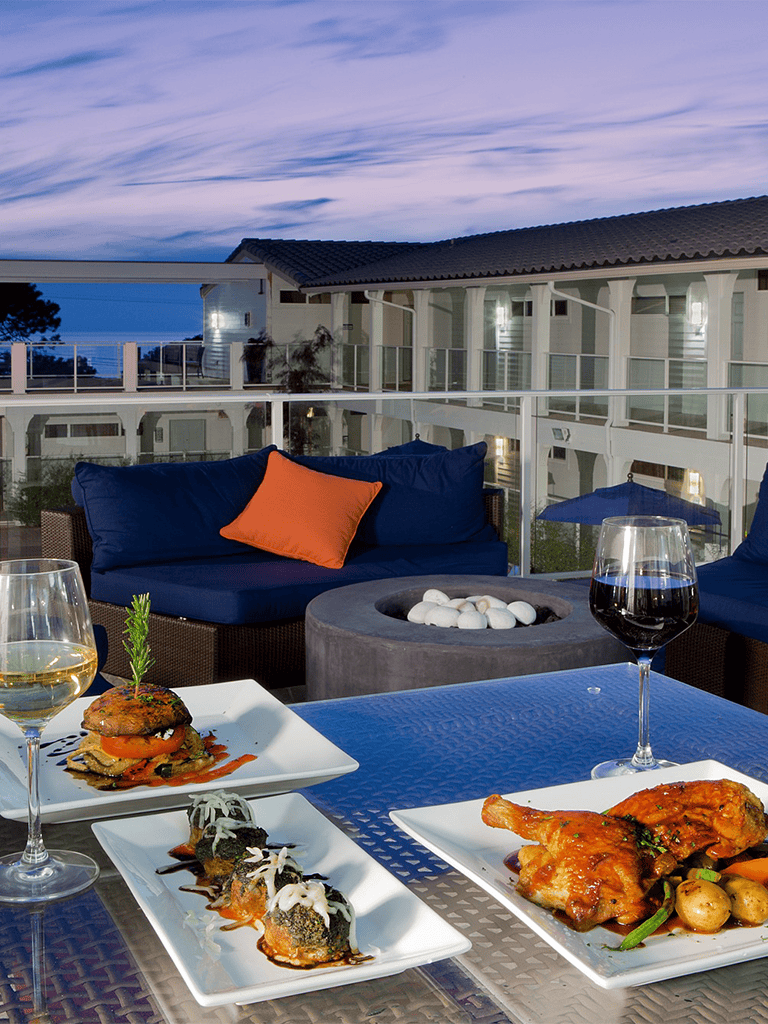 Elegant rooftop dining with outdoor seating, stylish decor, and delicious gourmet dishes at QuestForDirections.