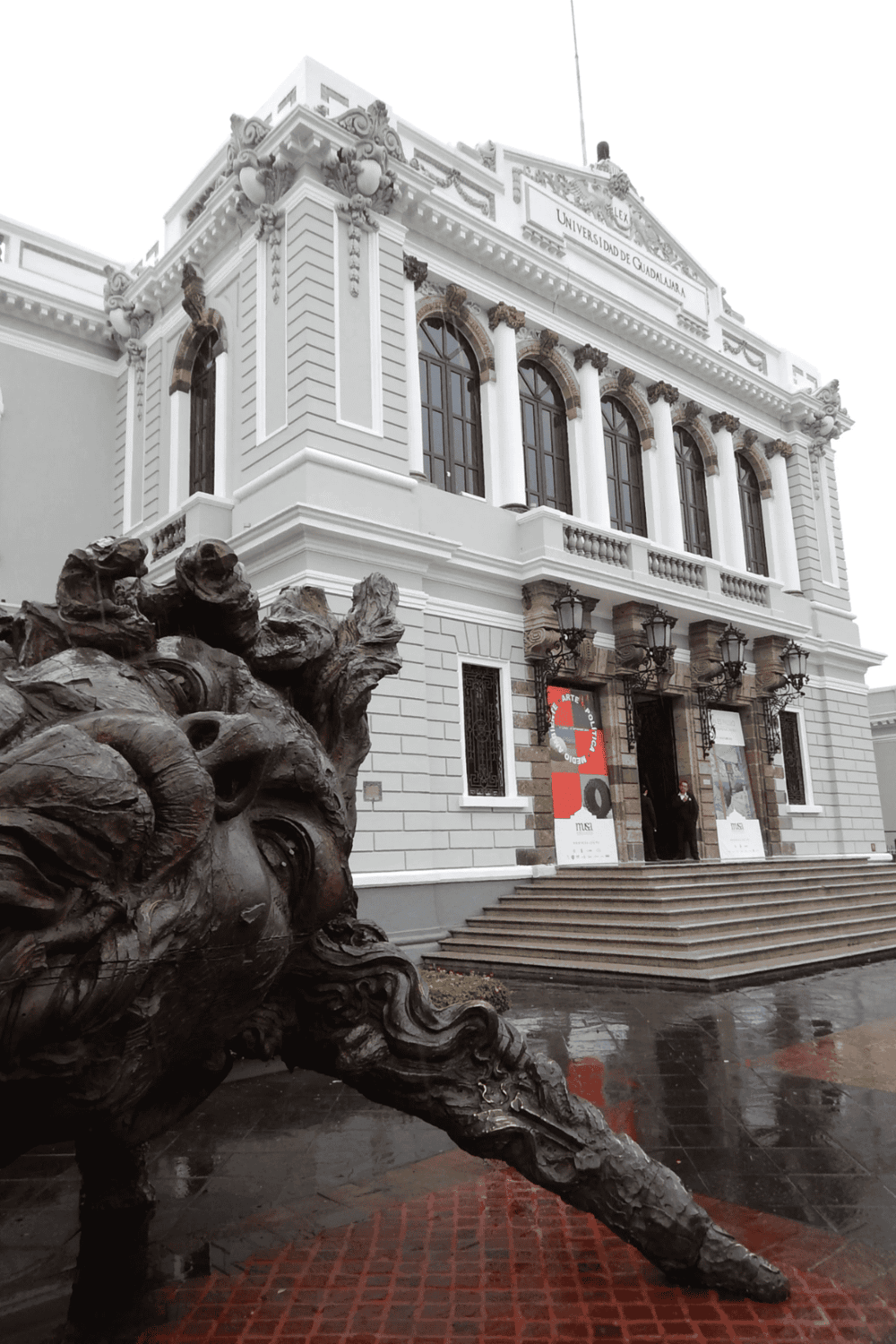 Historic university building in Guadalajara, Mexico, with classical architecture and ornate details.
