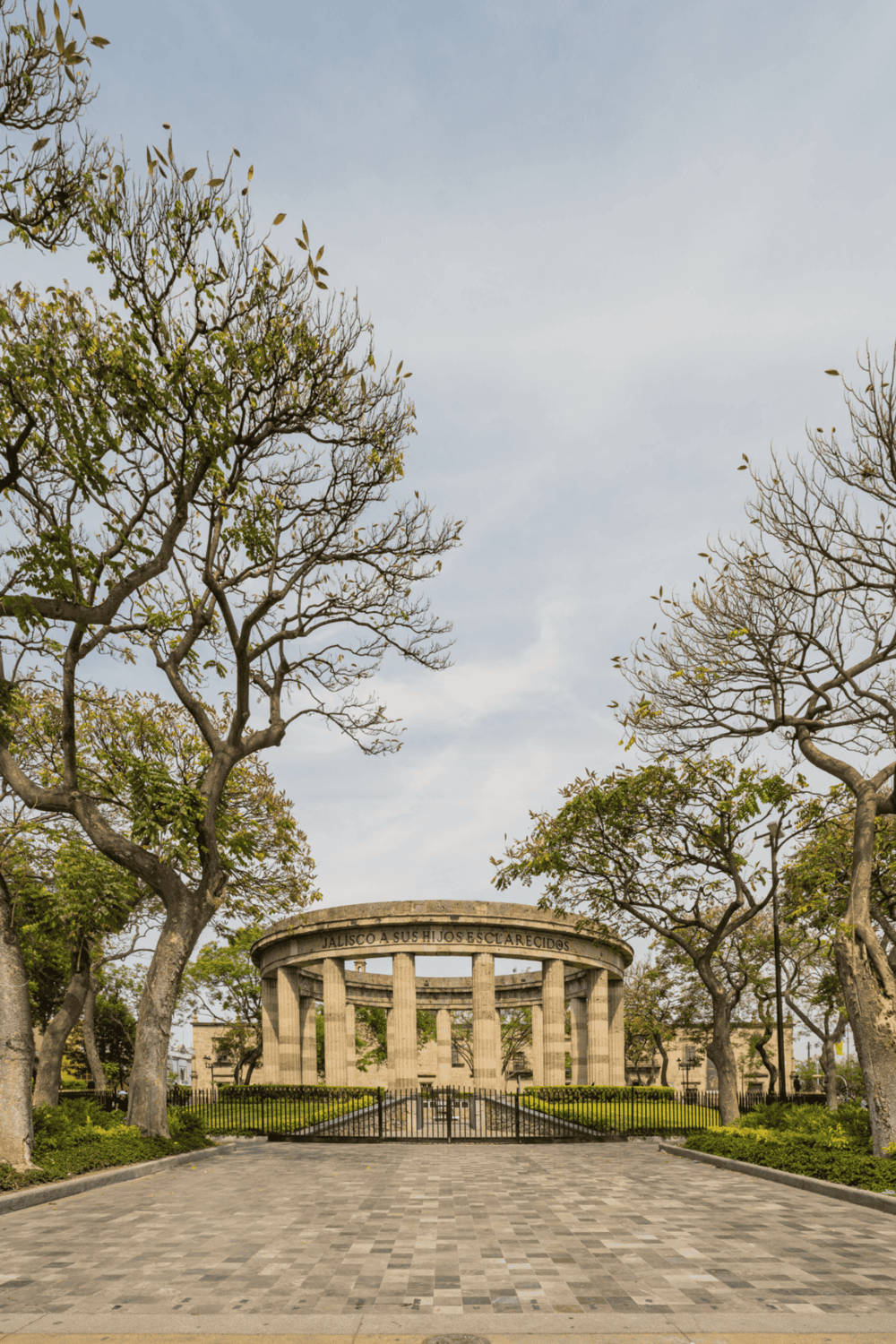 Mountain eternal spring park in Guadalajara, Mexico, showcasing lush trees and classic architecture.