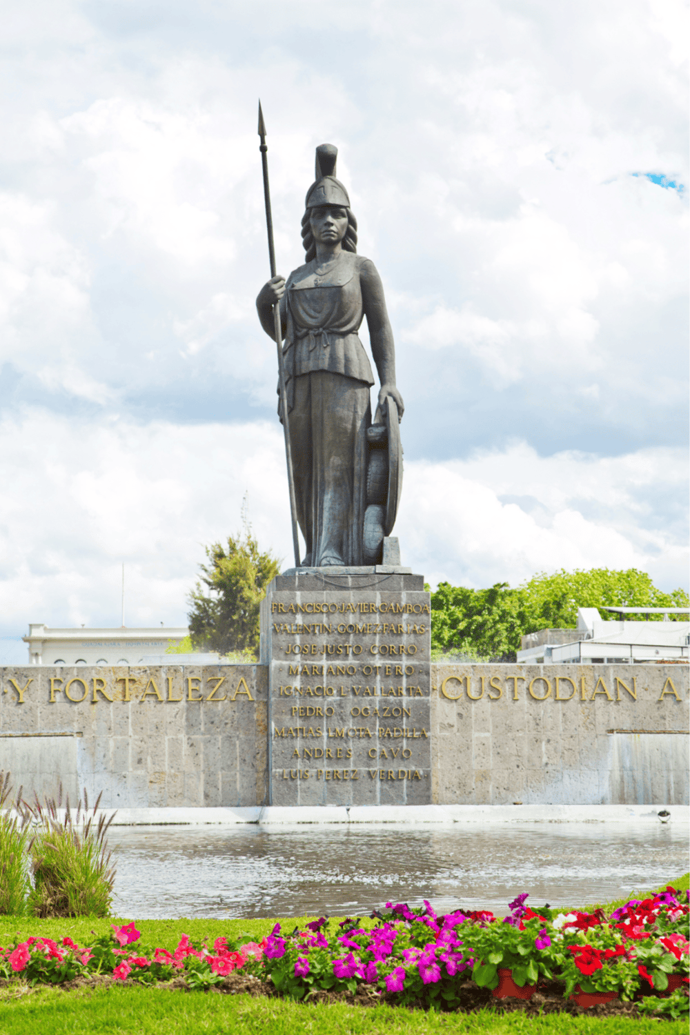 Bronze statue of a historic female figure in Mexico City, symbolizing culture and history.