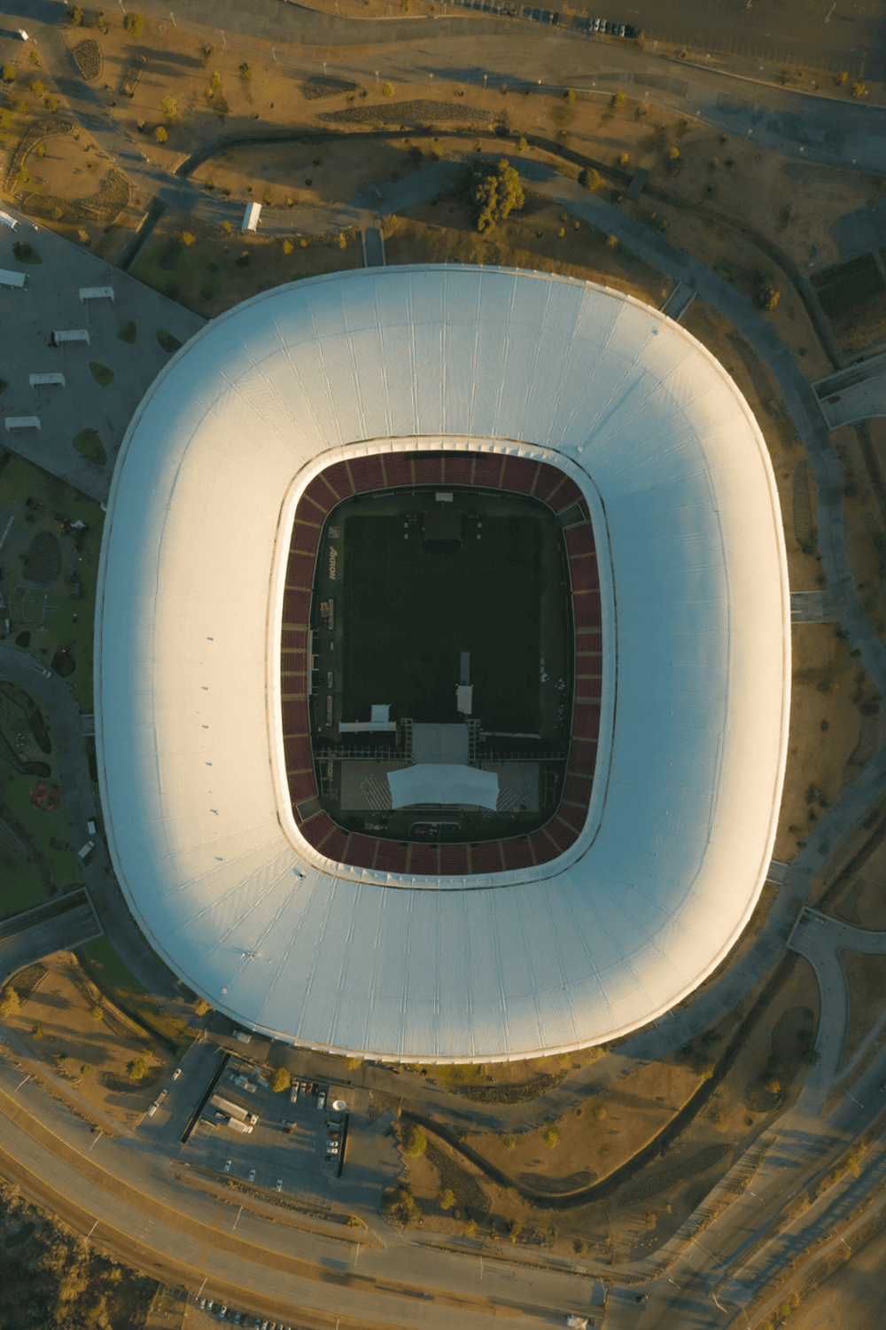 Aerial view of questfordirections stadium showcasing modern architecture and surrounding park areas.