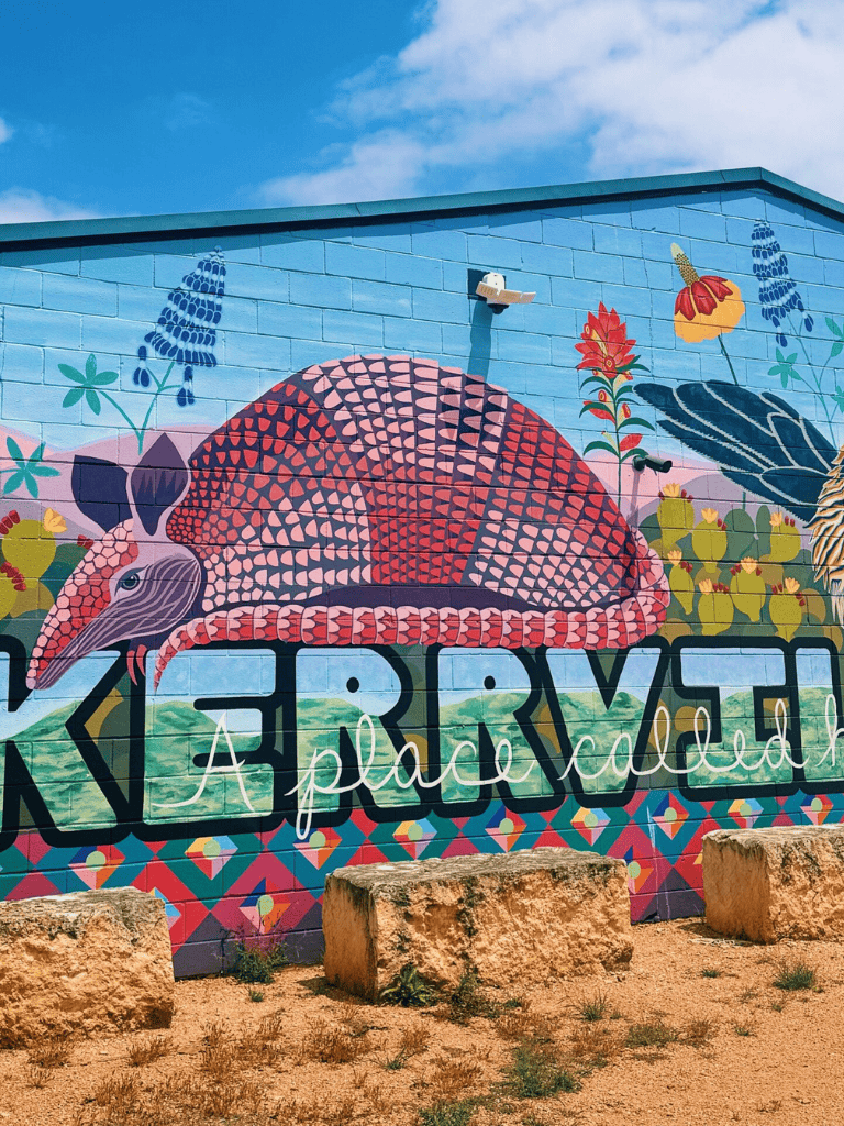 Colorful mural of a quail on a vibrant building wall, emphasizing local culture and artistic expression.