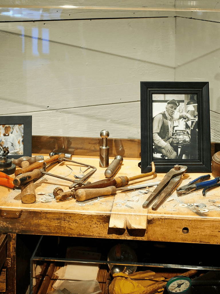 Antique woodworking tools and vintage framed black-and-white photo at Quest for Directions.