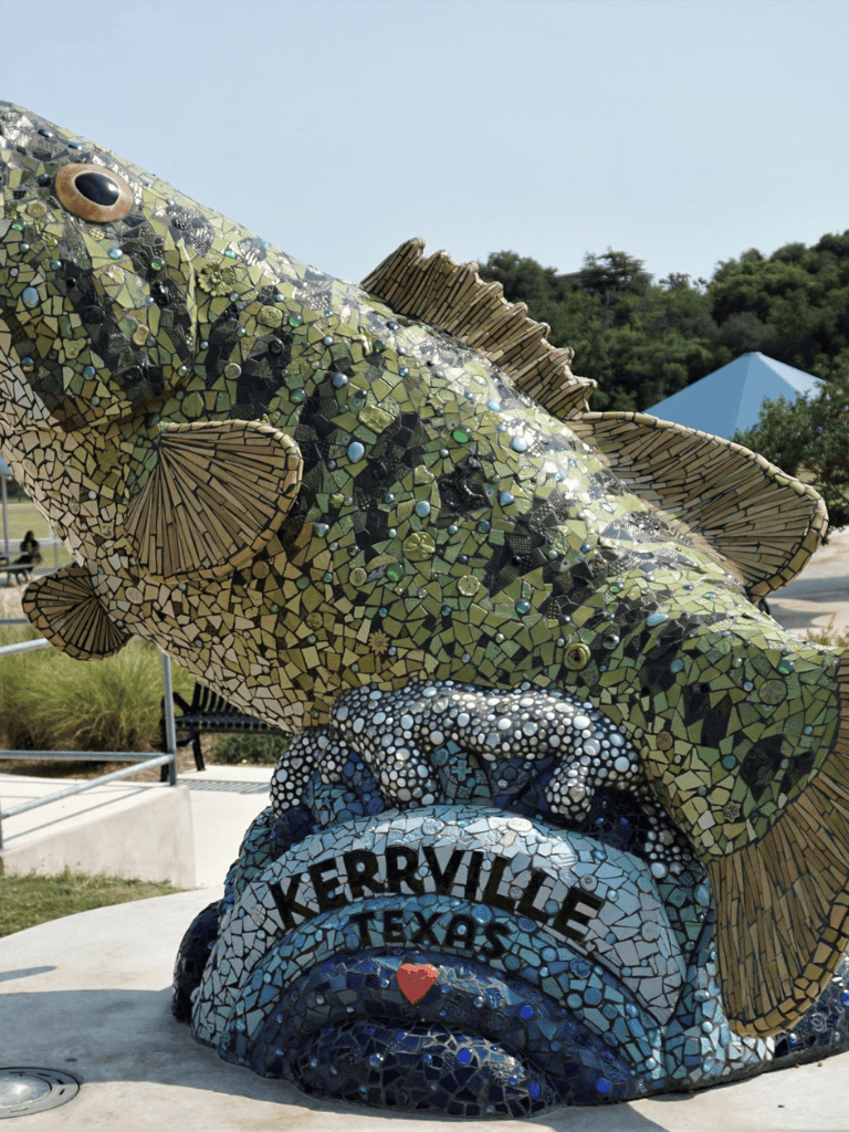 Colorful mosaic fish sculpture at Kerrville, Texas, with detailed artwork and vibrant colors.