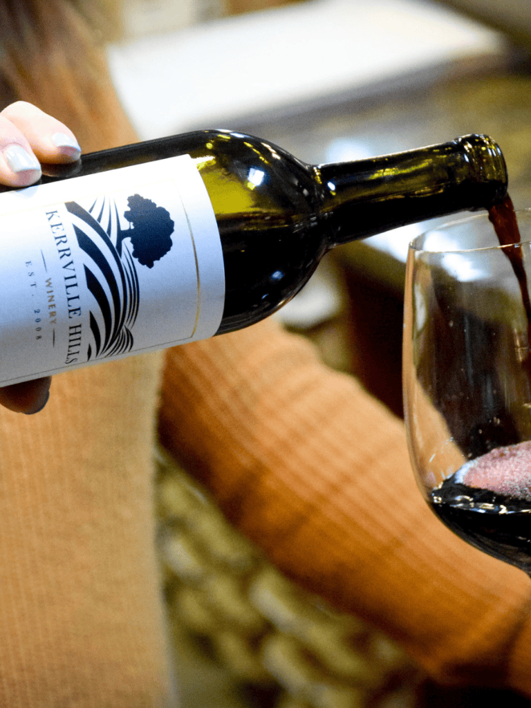 Refreshing red wine poured into a glass, showcasing winery experience at Keererville Hills Winery.