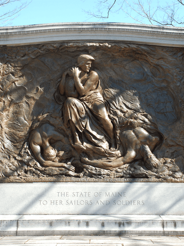 Bronze memorial monument honoring Maine's sailors and soldiers, featuring detailed sculpture and inscribed dedication.