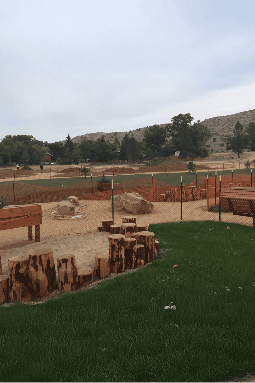 Beautiful outdoor playground area with scenic mountainous background, designed for children's activities and family fun.