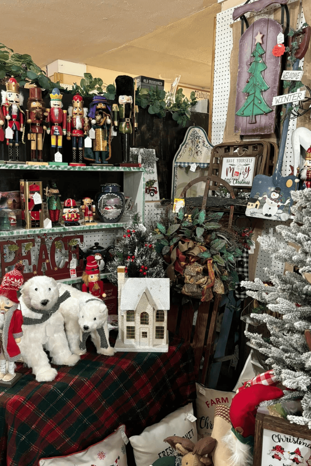 Colorful Christmas decorations including nutcracker figurines, plush animals, and festive wreaths.