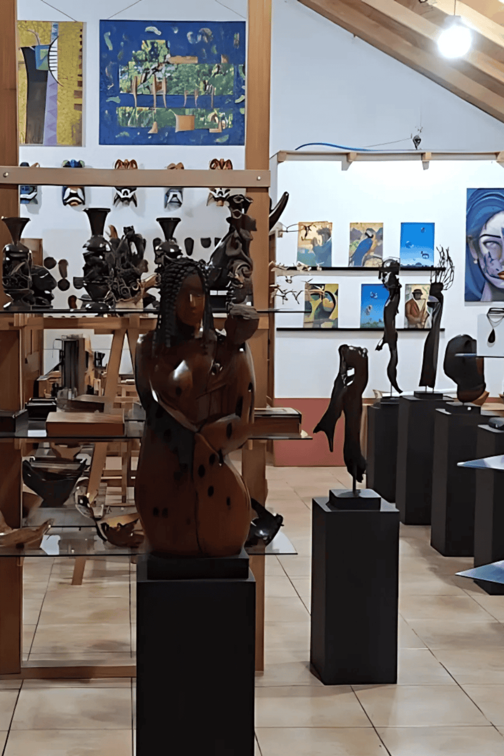 Elegant African wood sculptures and contemporary art in an art gallery for cultural exploration and artistic inspiration.