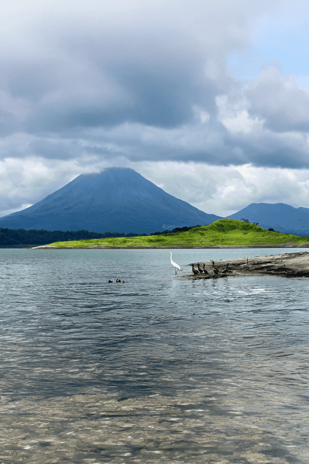 Majestic volcano and lake scenic landscape, QuestForDirections travel experience, natural beauty, outdoor adventures, travel destination.