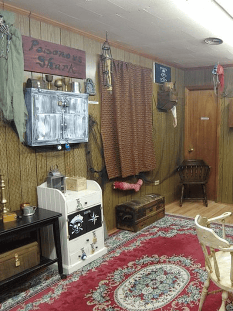 Vintage rustic living room decor with storage and cozy charm.