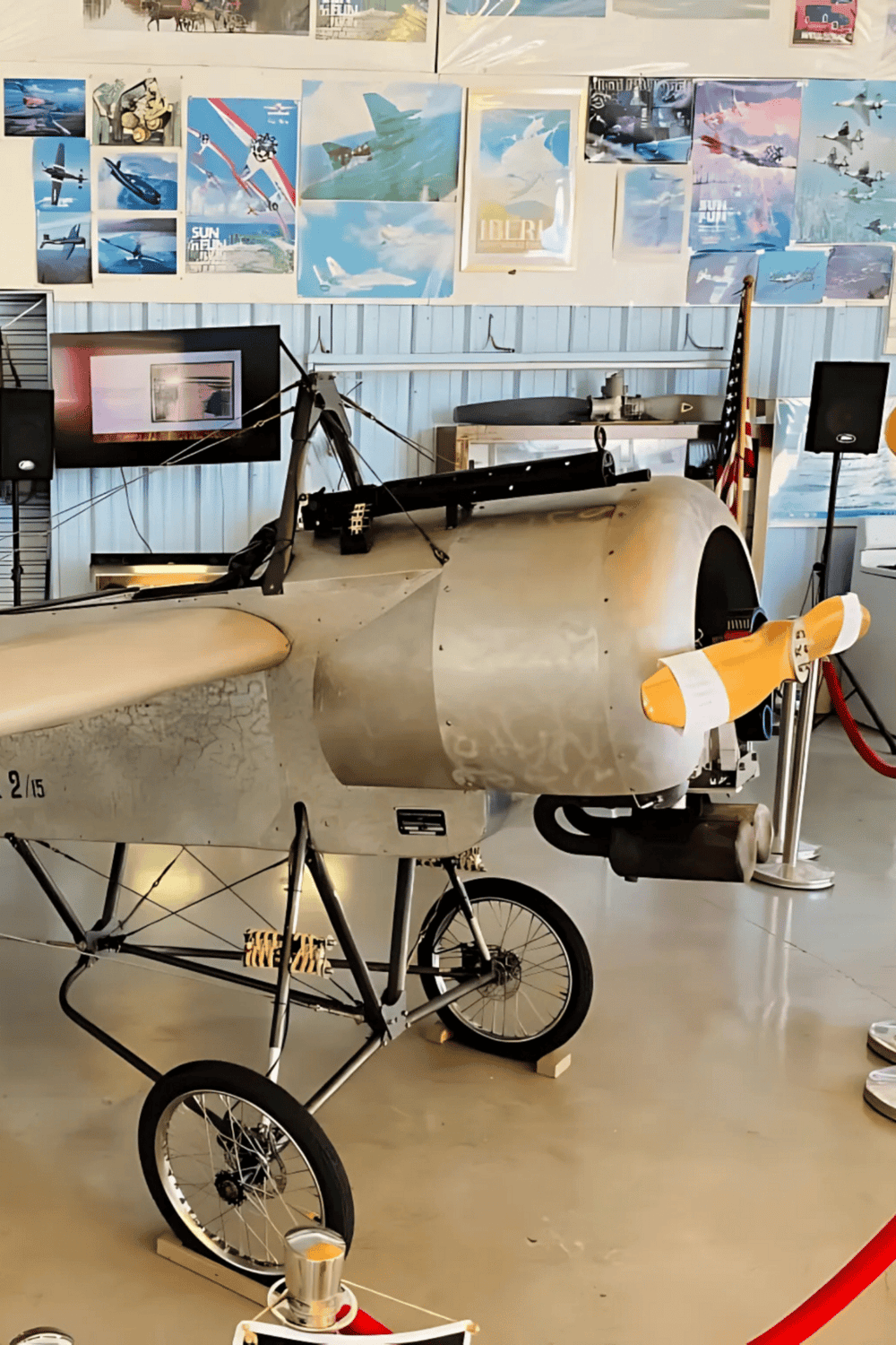 - Vintage aircraft bicycle museum display with airplane fuselage and propeller.
