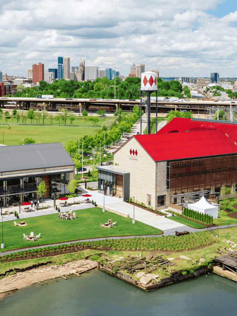 Modern cityscape with waterfront dining and lush green spaces in downtown QuestForDirections area, perfect for relaxation and urban exploration.