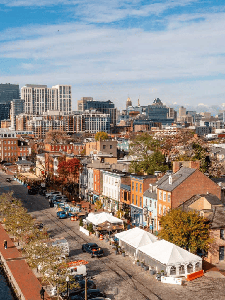 Vibrant cityscape featuring historic buildings and modern skyscrapers in a bustling downtown area.