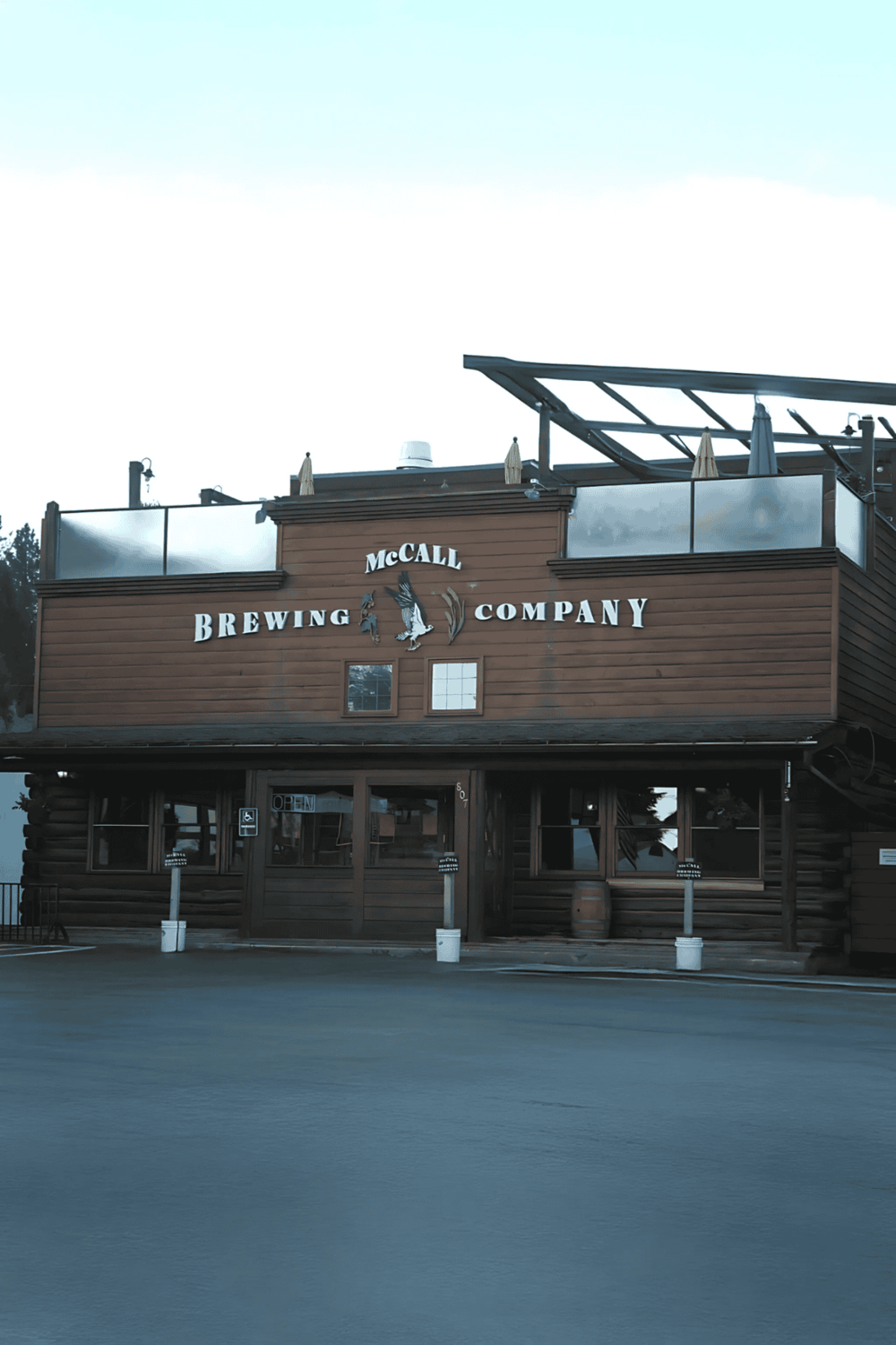 1. Brewery restaurant on a wooden building in a scenic outdoor setting.
