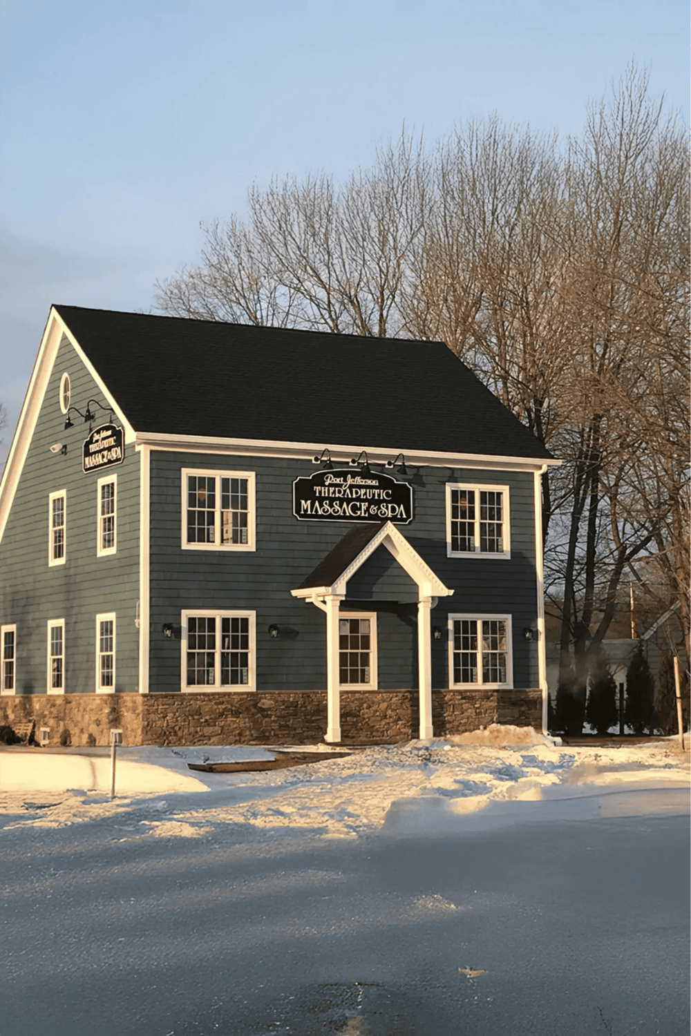 Massage therapy and spa center in a cozy, traditional building during winter.
