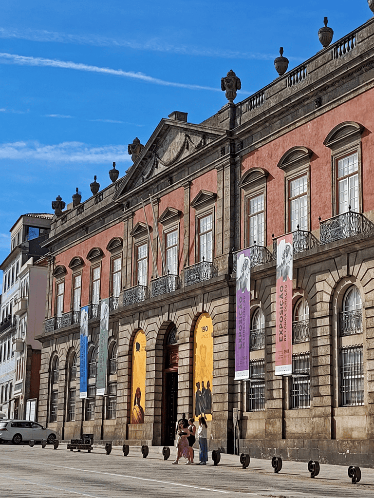 1. Historic building in Portugal with colorful banners promoting art exhibitions and cultural events.