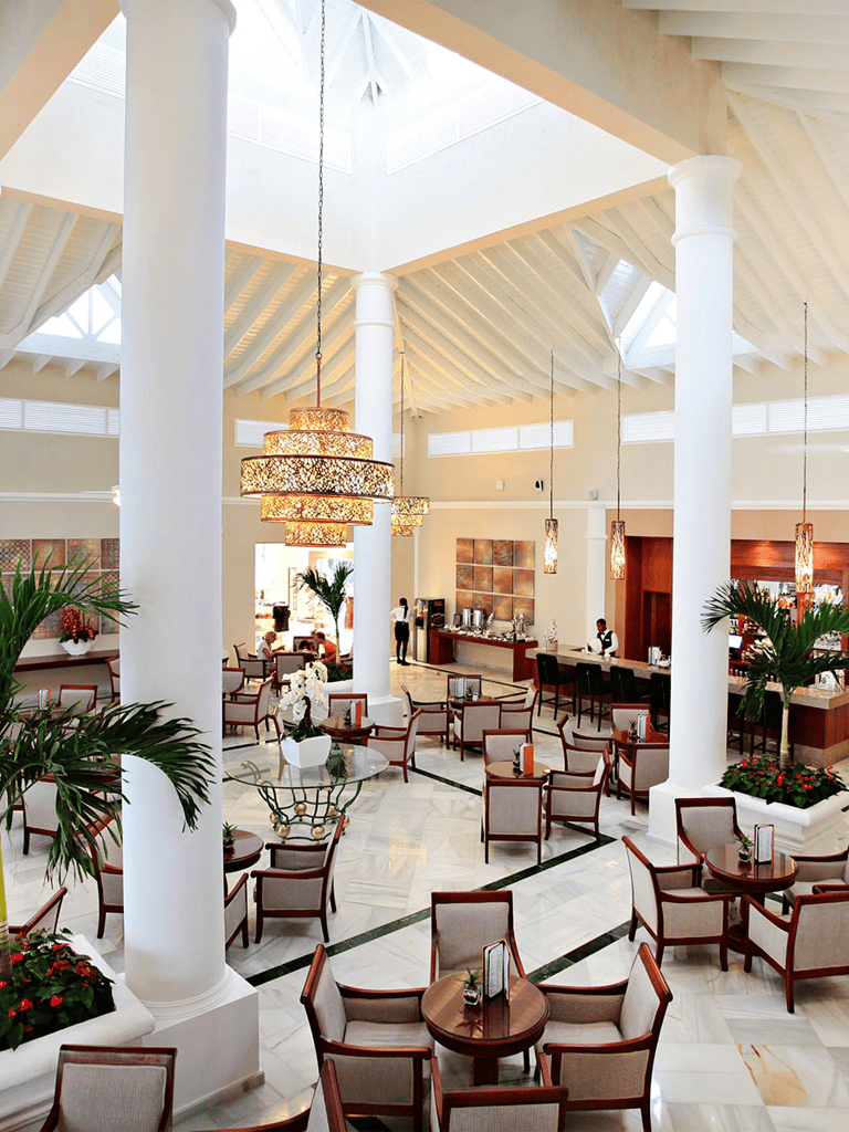 Luxury hotel lobby with elegant seating and grand chandeliers, perfect for travelers seeking comfort and style.