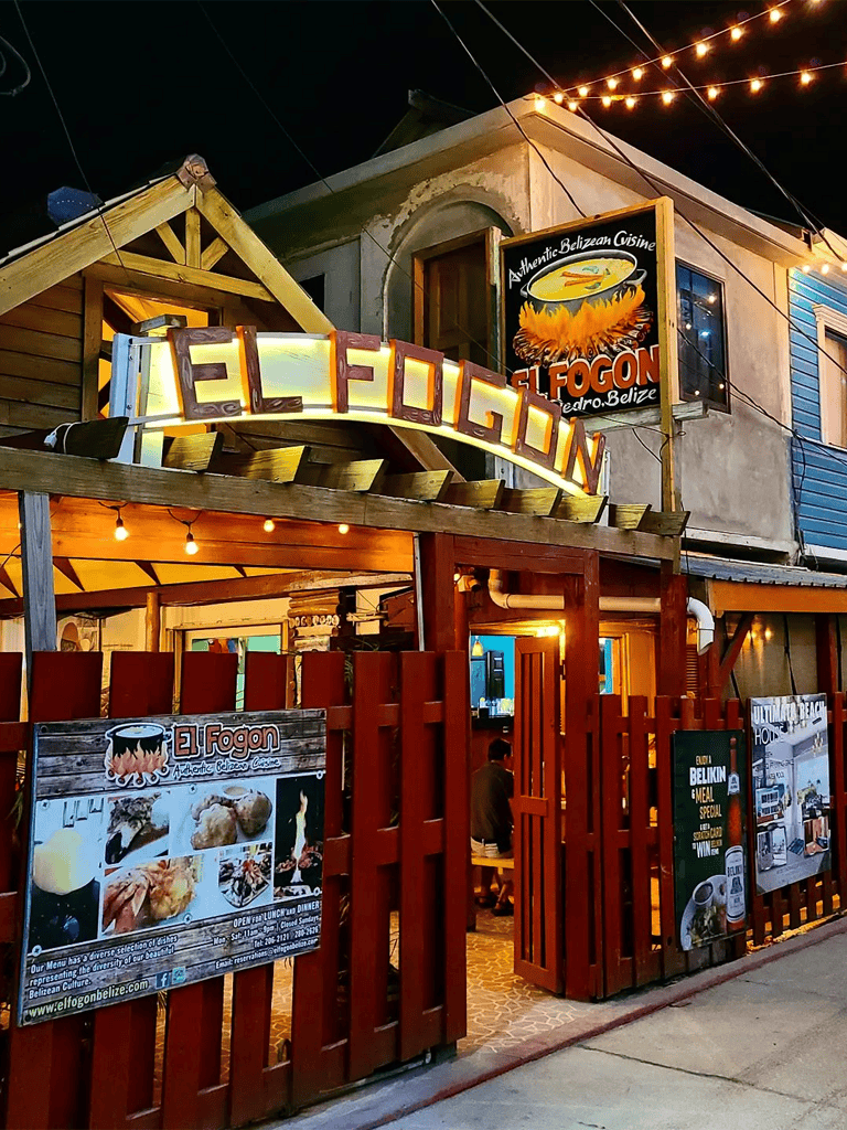 Authentic Belizean cuisine at El Fogon restaurant in Pedro Belize, vibrant outdoor dining setting.