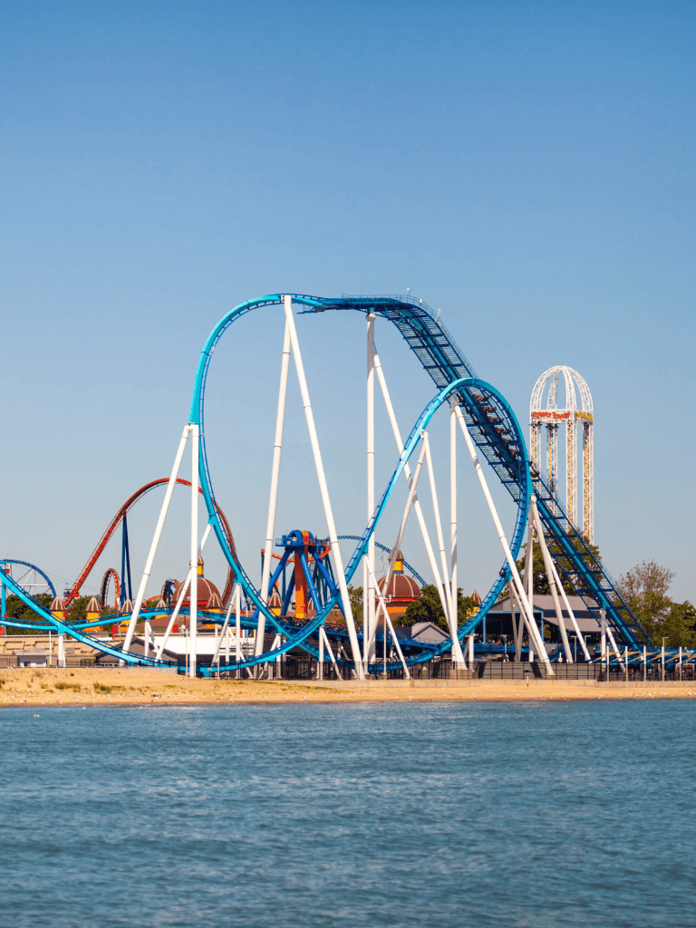 Thrilling roller coaster ride at Quest for Directions amusement park on the waterfront.