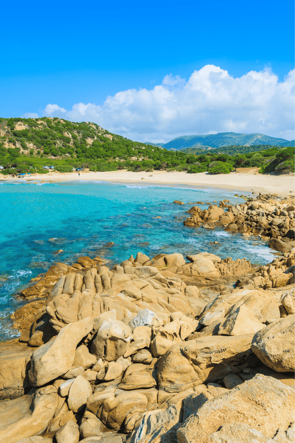 Secluded beach with turquoise water and rocky shoreline, perfect for coastal relaxation and oceanfront views.