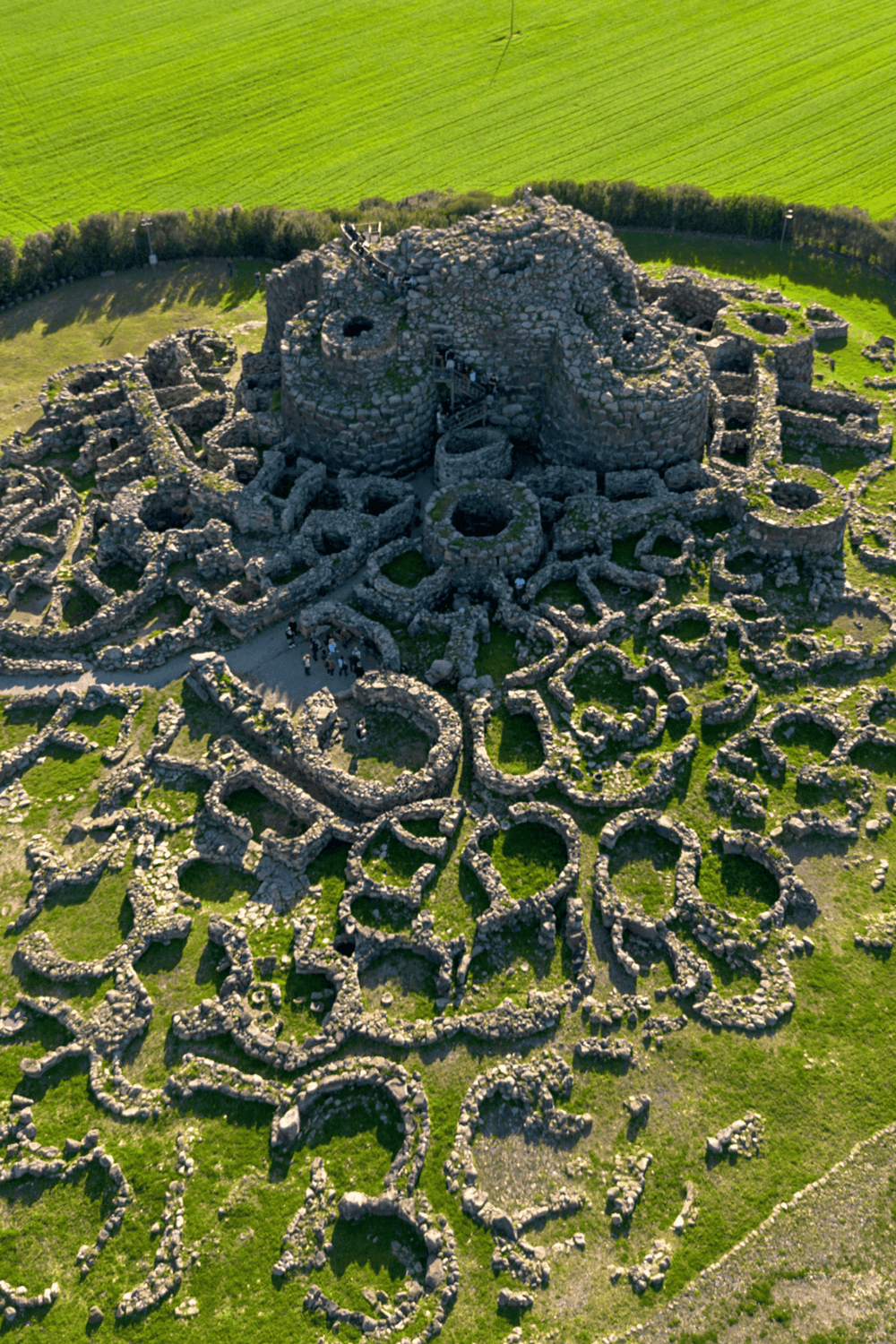 Ancient stone castle ruins with intricate labyrinth design, breathtaking landscape view.