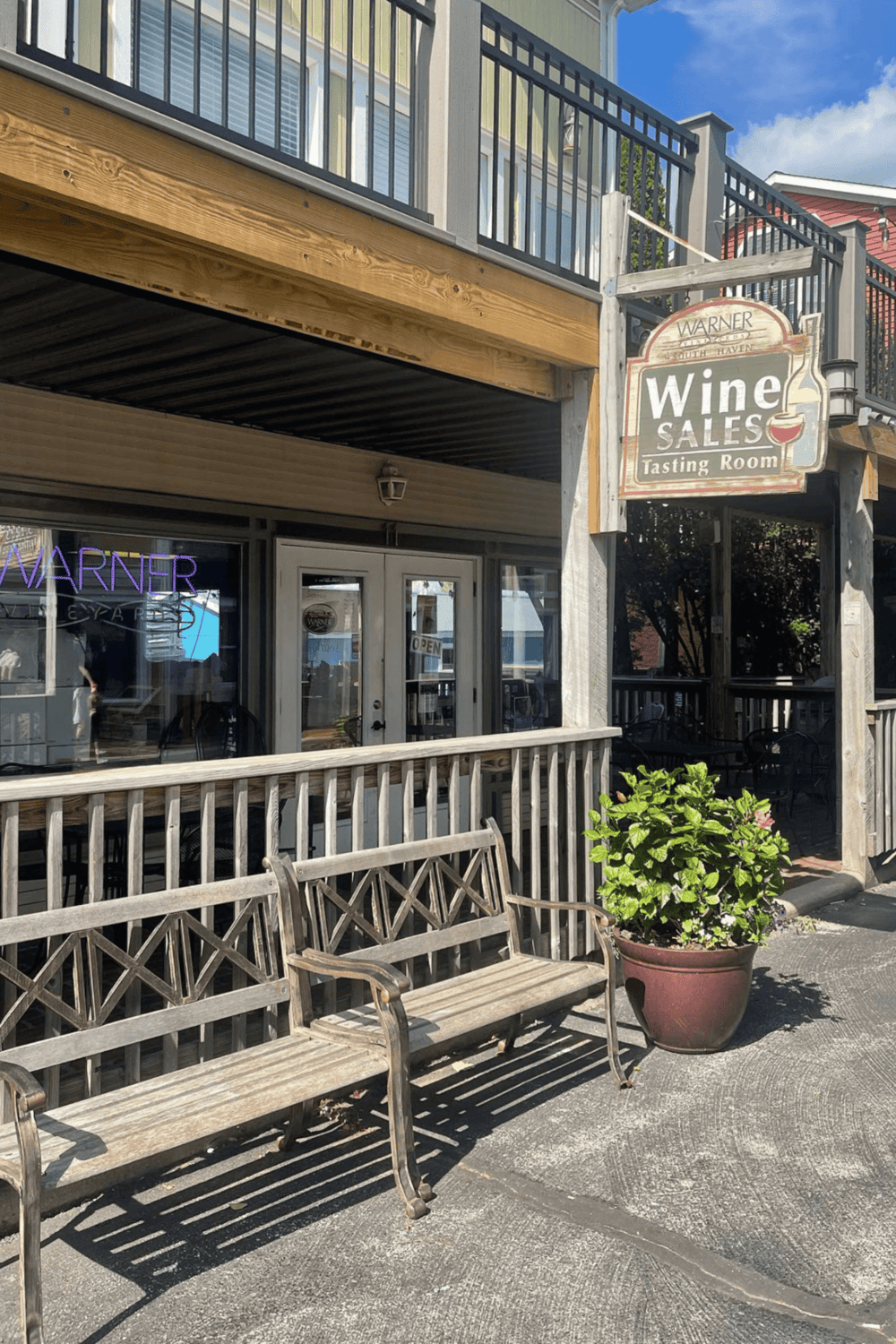 Charming wine tasting room with outdoor seating and welcoming atmosphere in South Haven.
