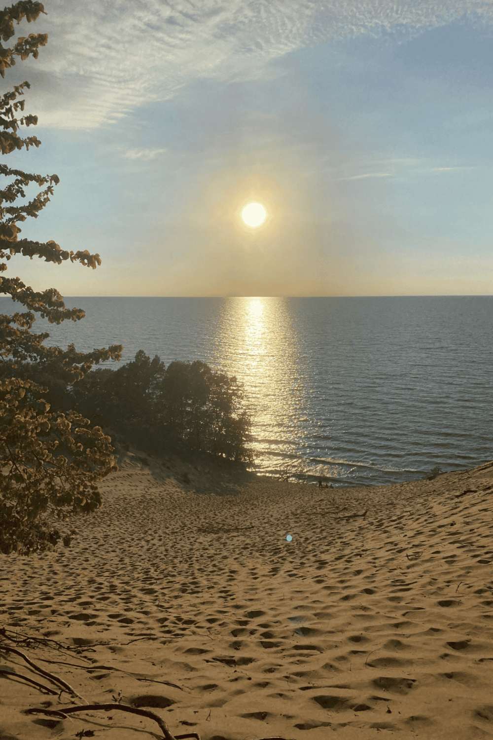 Serene sunset on the beach over the ocean, ideal for travel, relaxation, and scenic destinations.