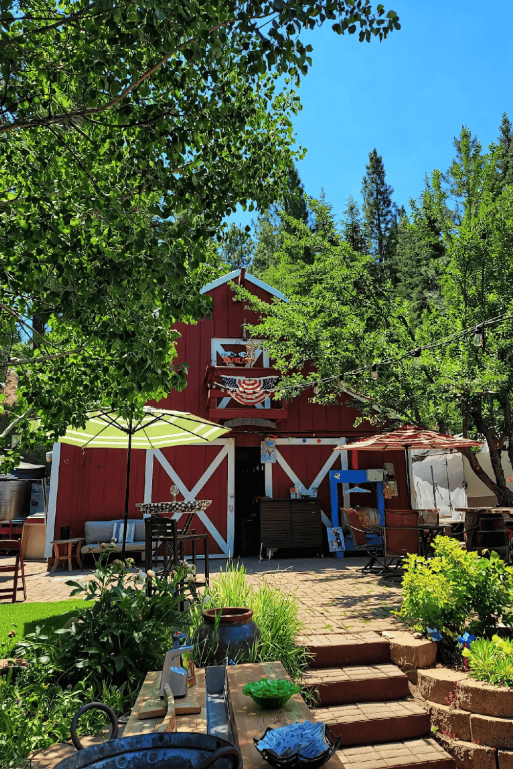 Charming rustic barn outdoor space with lush greenery, perfect for garden design and outdoor living.