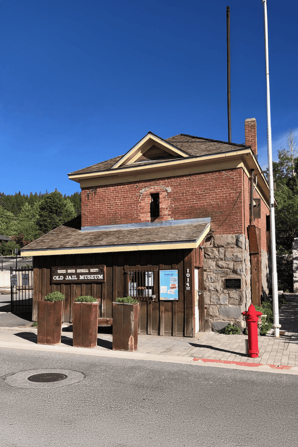 Old jail museum building with historical significance and rustic design in a small town setting.
