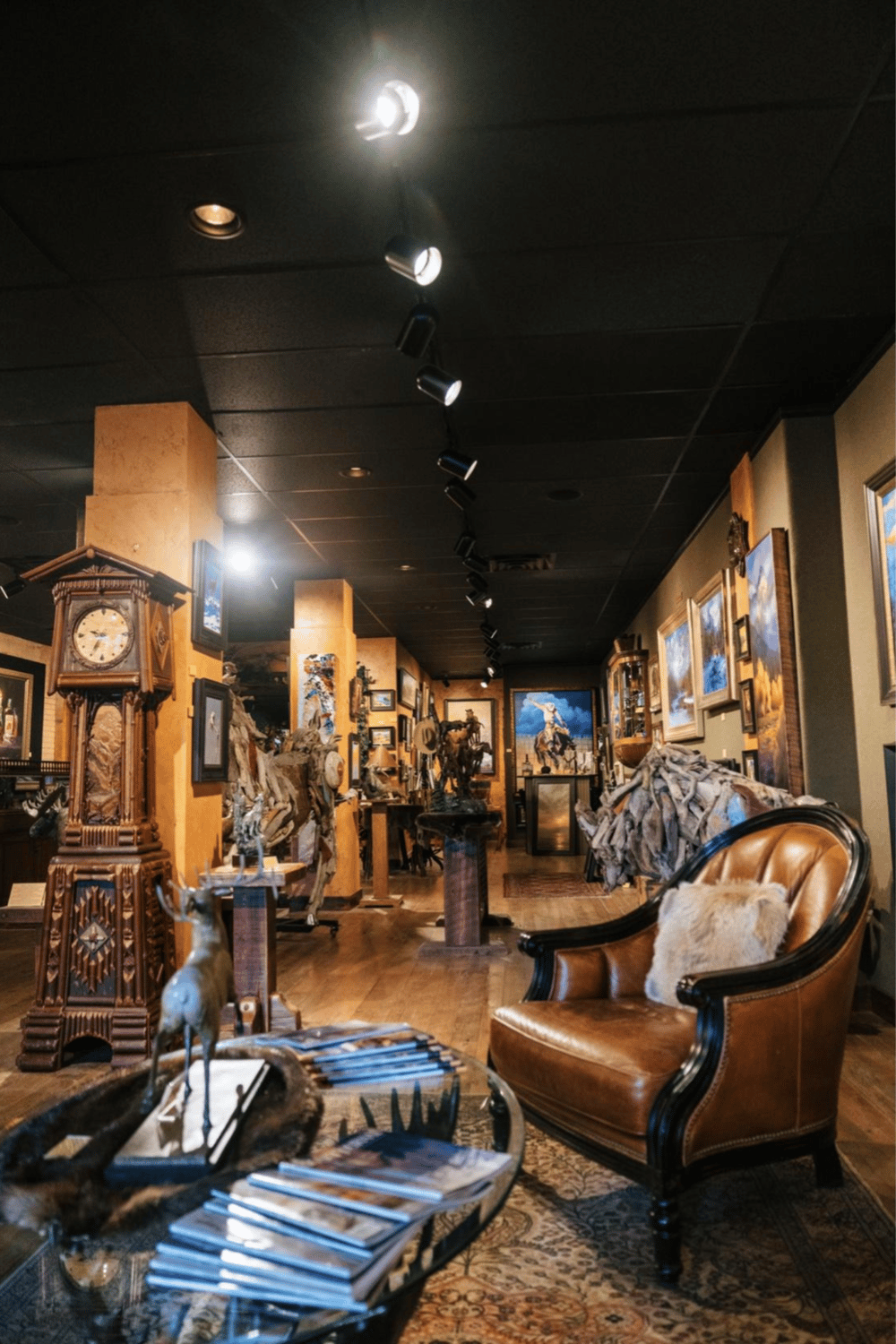 Colorful art gallery with paintings, sculptures, and cozy seating at QuestForDirections.