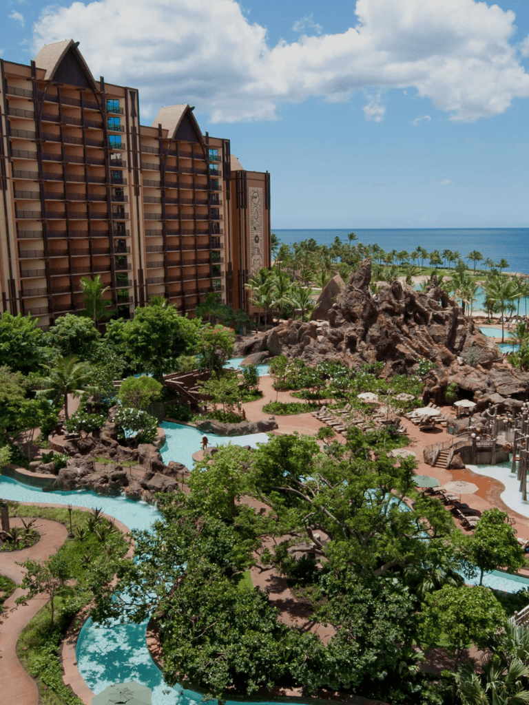 Lush tropical resort with water slides and ocean view in tropical paradise.