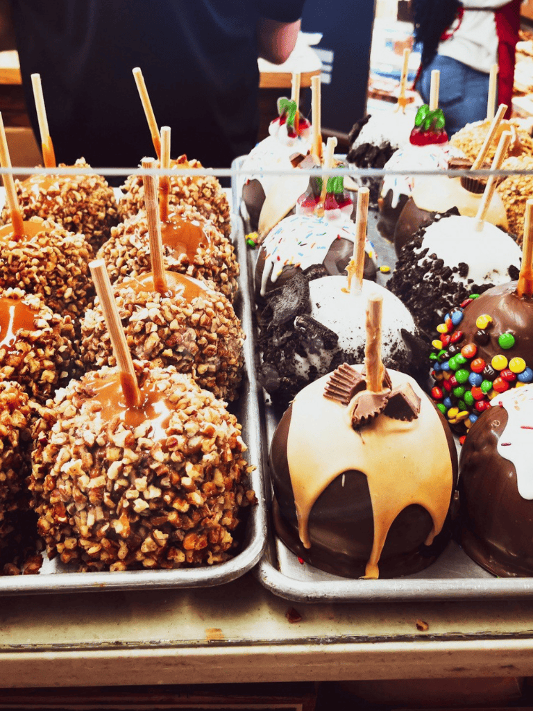Decadent gourmet cake pops with various toppings at QuestForDirections dessert shop.
