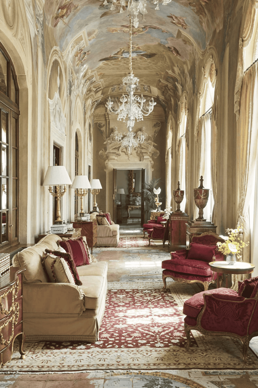 Luxurious historic mansion interior with elegant chandeliers and ornate furnishings.