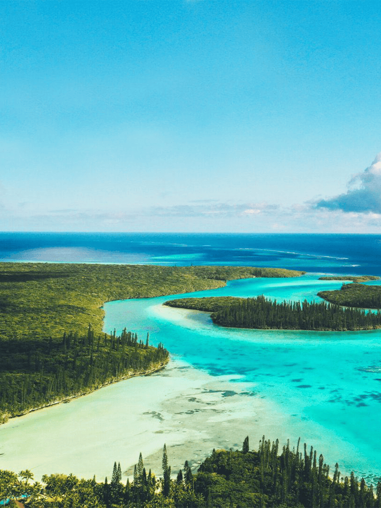 Stunning coastal landscape with turquoise waters and lush greenery in the QuestForDirections image.