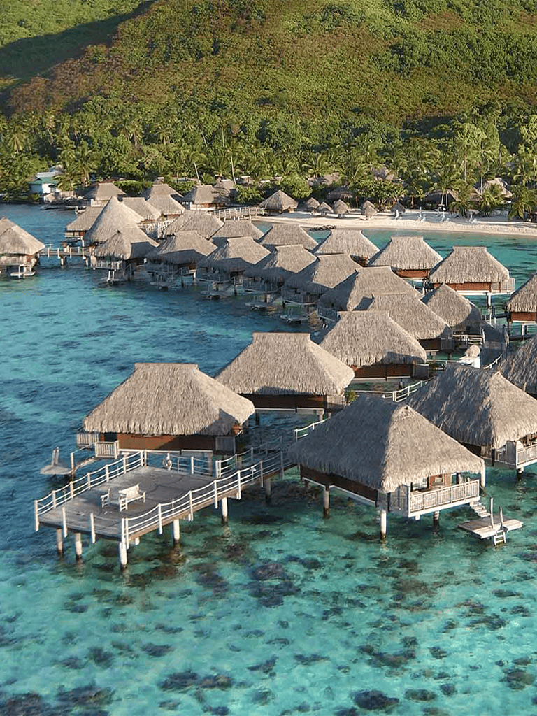 Overwater bungalows in Maldives with overwater decks and turquoise waters.
