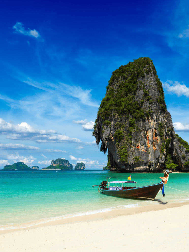 Breathtaking tropical beach with limestone cliffs and clear turquoise waters.