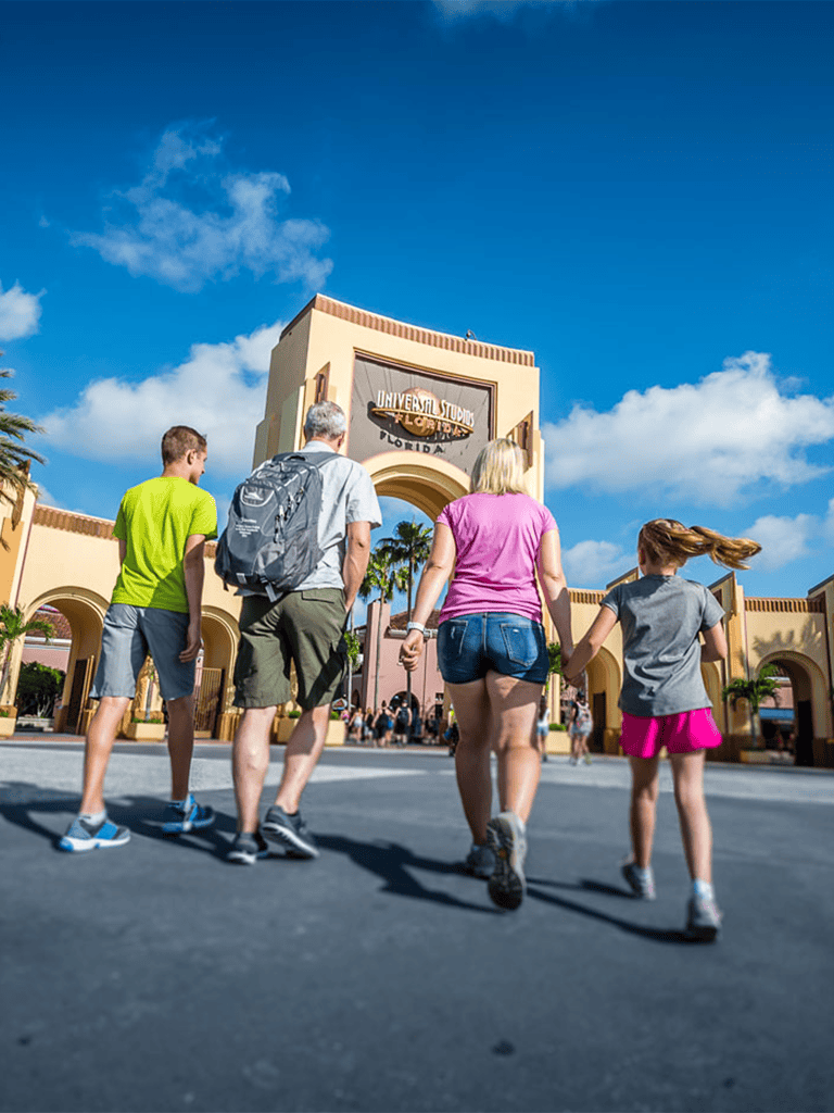 Bright group walking towards Universal Studios Florida entrance, a top Orlando family-friendly theme park attraction.
