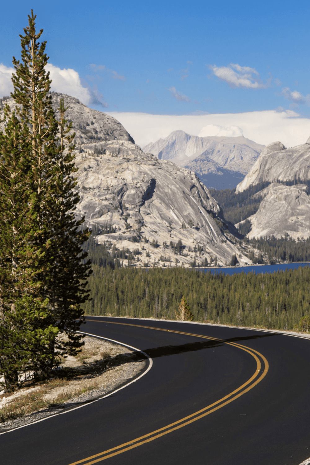 Serene mountain landscape with a winding road, perfect for adventure travel and outdoor exploration.