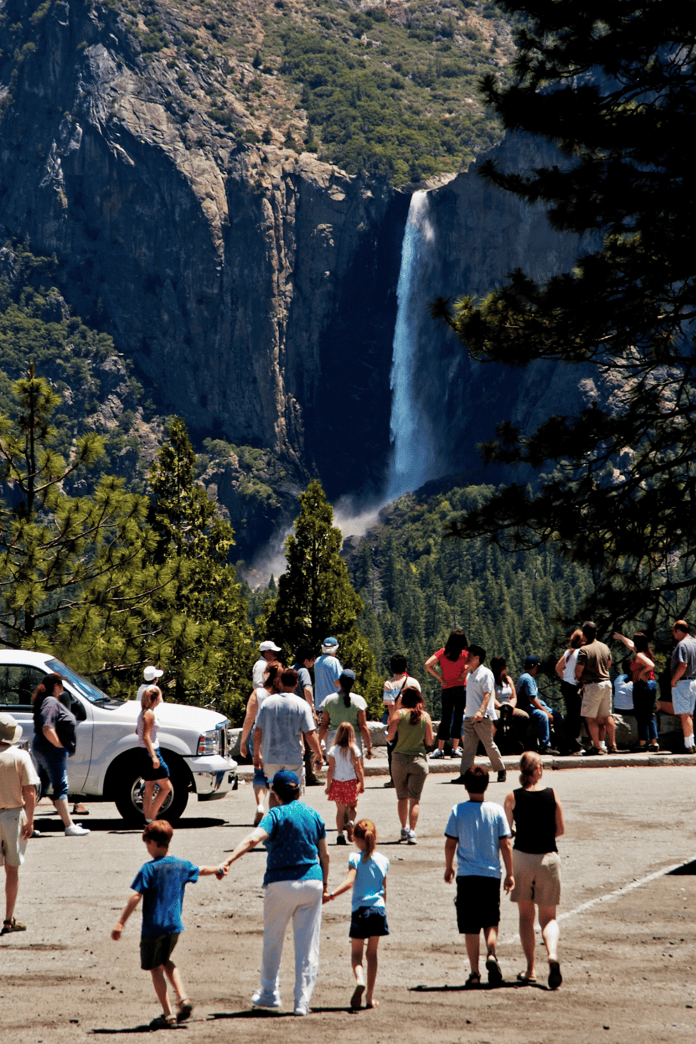 Vancouver waterfalls, tourists sightseeing in nature, famous landscape, outdoor adventure, travel destination, scenic views, nature exploration.