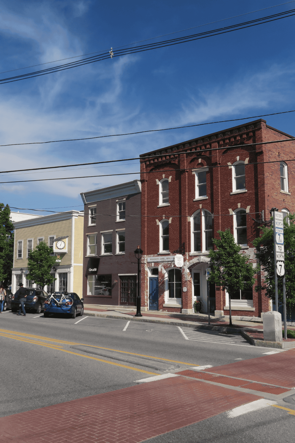 Historic downtown buildings in QuestForDirections cityscape, vibrant urban streetscape with colorful architecture.