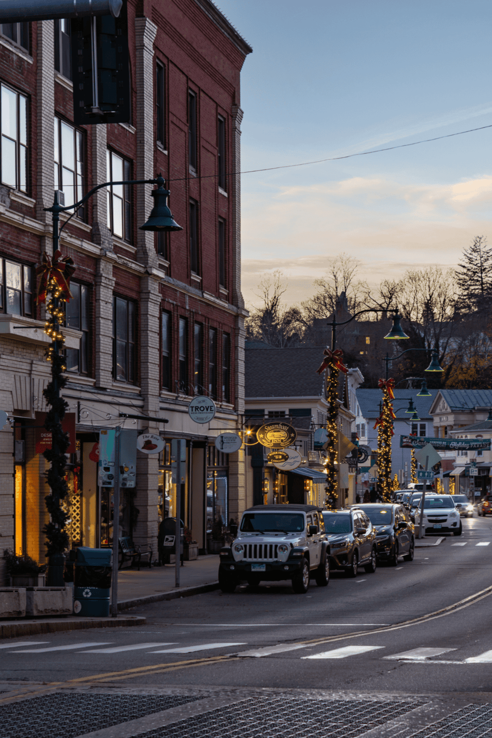 Charming downtown street with festive holiday decorations, perfect for urban exploration and local shopping.