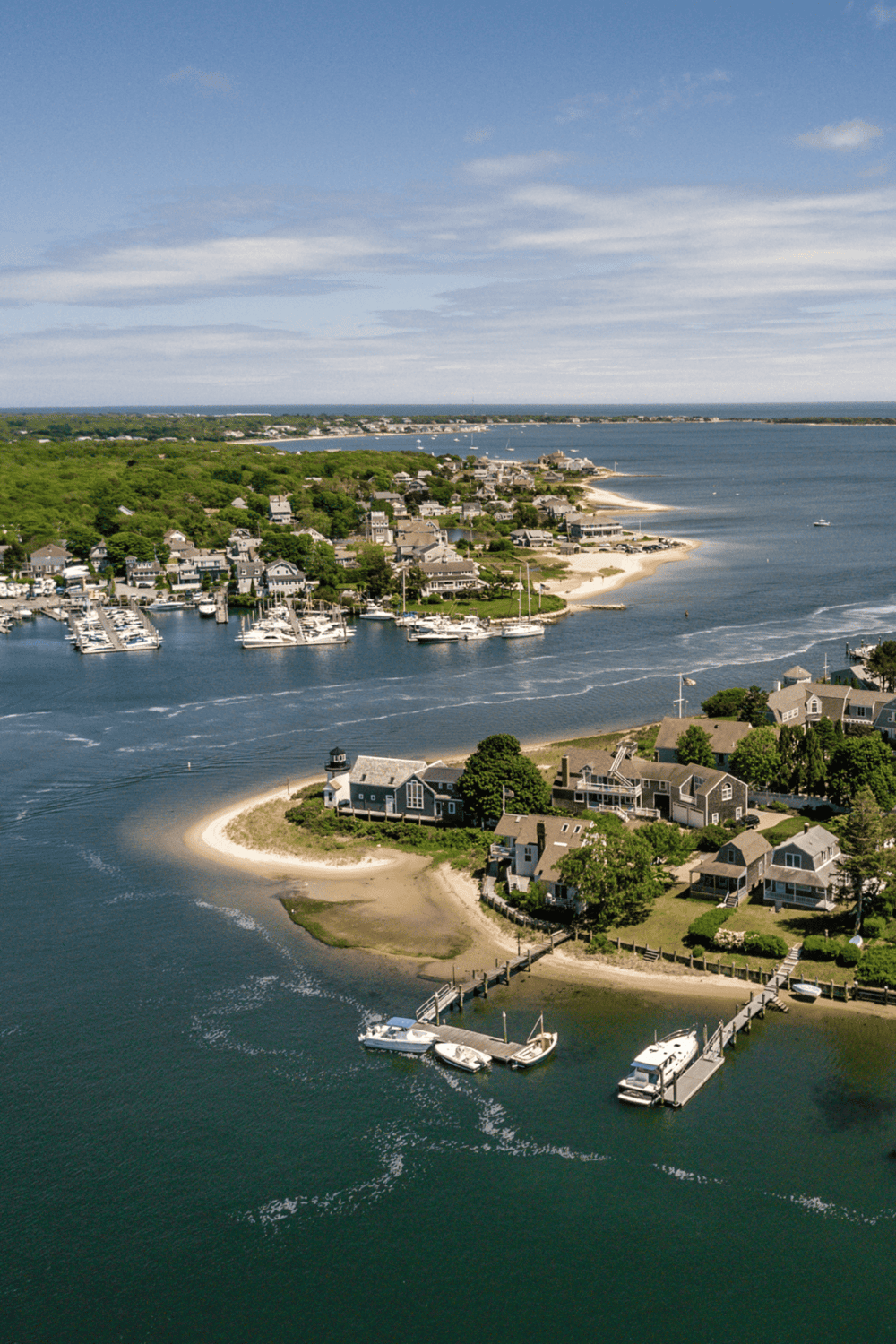 Relaxing coastal waterfront neighborhood with houses, boats, and scenic ocean views.