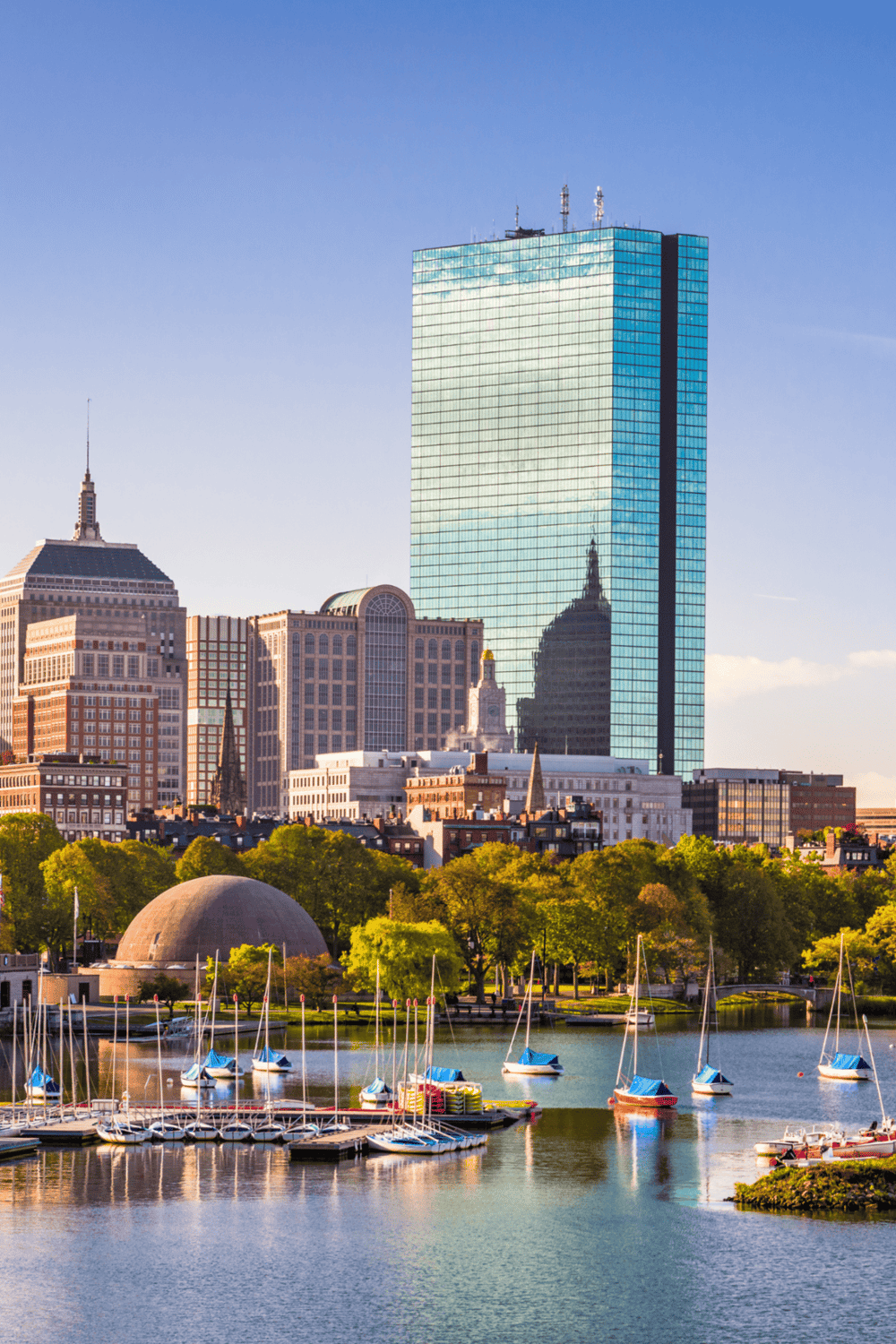 Modern city skyline with high-rise buildings and marina, Boston skyline with waterfront, skyscrapers and boats.